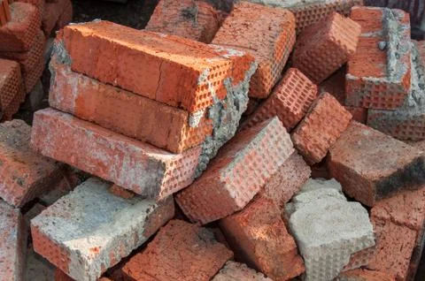 Background of red brick. Old red brick at a construction site. Old brick unsu Stock Photos