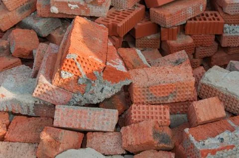 Background of red brick. Old red brick at a construction site. Old brick unsu Stock Photos