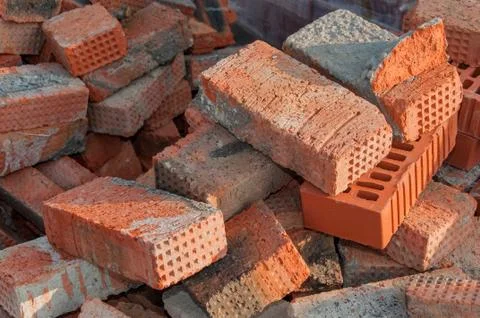 Background of red brick. Old red brick at a construction site. Old brick unsu Stock Photos