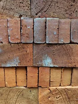 Background of red brick pile Stock Photos