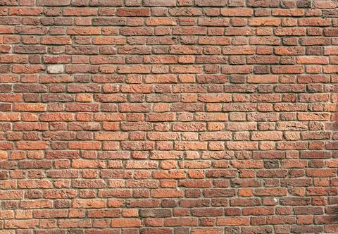 The background is a red brick texture Stock Photos