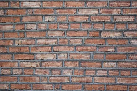 Background of red brick wall . Construction concept Stock Photos