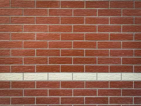 Background red brick wall with one line of white bricks Stock Photos