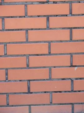 Background of red brick wall pattern texture. Great for graffiti inscriptions Stock Photos