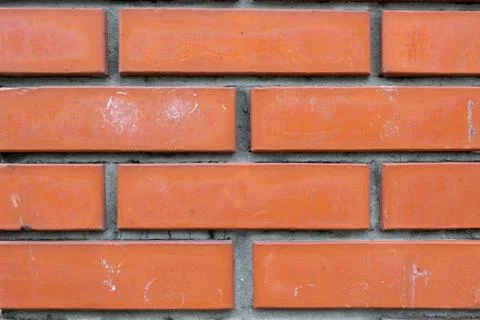 Background of red brick wall pattern texture. Great for graffiti inscriptions. Stock Photos