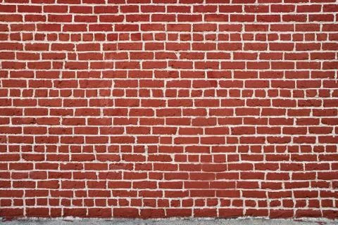 Background of red brick wall pattern texture. Great for graffiti inscriptions. Stock Photos