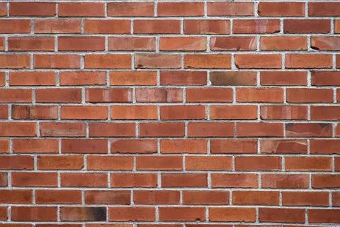 Background of red brick wall pattern texture. Great for graffiti inscriptions Stock Photos