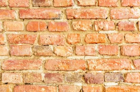 Background of red brick wall pattern texture, great for graffiti inscriptions Stock Photos