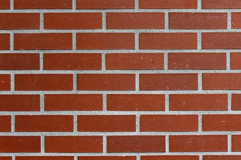 Background with a red brick wall Stock Photos