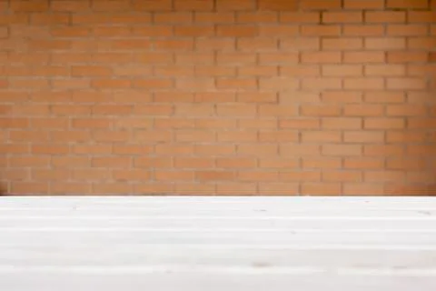 Background red bricks wall over white wood floor Stock Photos