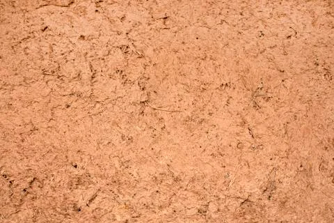 Background of red clay. The wall is covered with clay. Foto stock