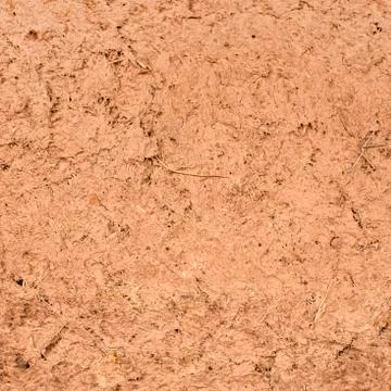 Background of red clay. The wall is covered with clay. Stock Photos