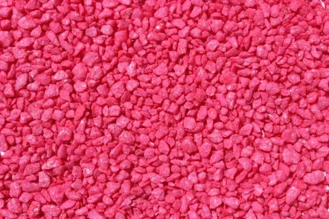 A background with red decoration granules Stock Photos