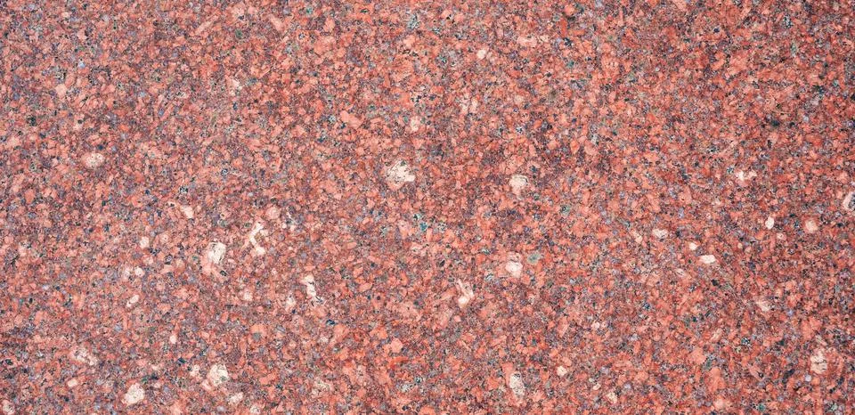 Background with red granite tile texture. Texture of natural granite stone for Stock Photos