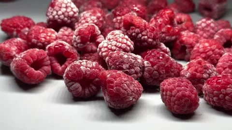 Background of red large frozen raspberries Stock Footage 313397358