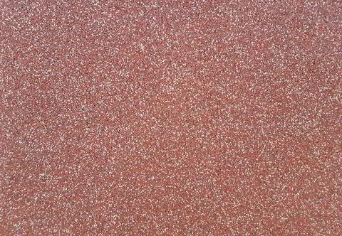 Background of red plaster with white flecks. Red plaster texture Stock Photos