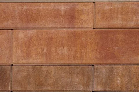 A background of red stone blocks Stock Photos