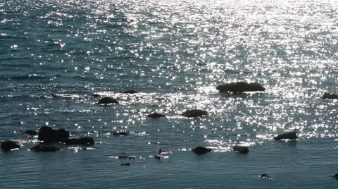 Background with reflections on the sea with stones Stock Footage 65498763