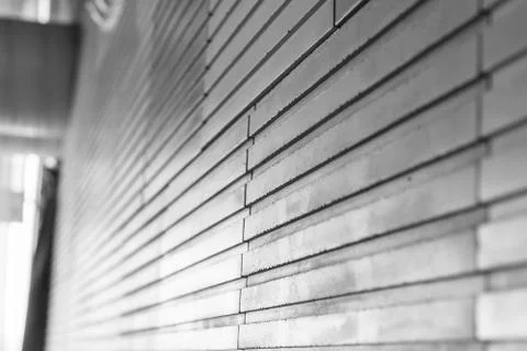 A background with relieved gray wall tile Stock Photos
