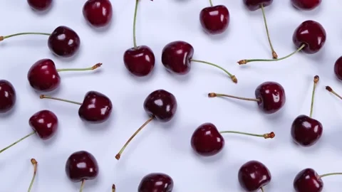 Background of ripe cherries with water drops on white background close-up top Stock Footage 198215149