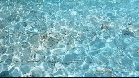 Background of rippled pattern of clean water in blue swimming pool Stock Footage 10908133