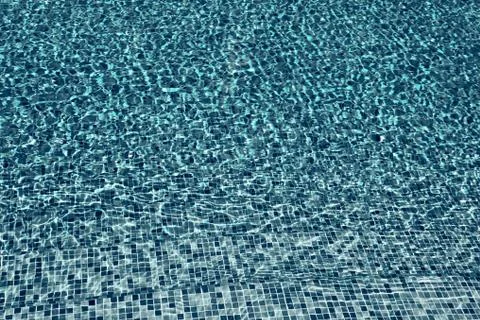 The background ripples the water on the surface of the pool Stock Photos