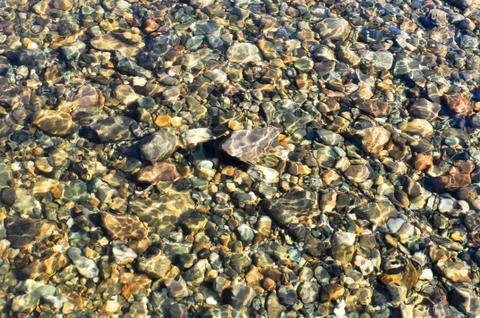 Background of river pebbles. Stock Photos