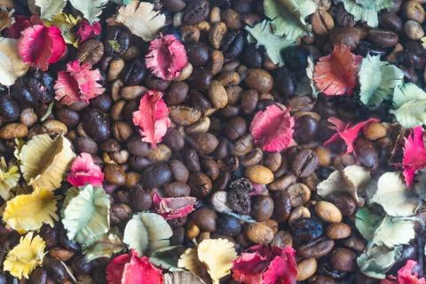 Background of roasted coffee beans with colourful dried Potpourri 写真素材