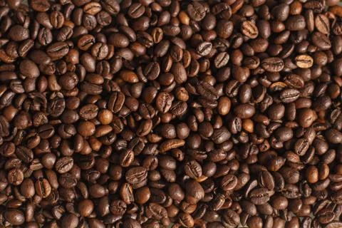 Background of the roasted coffee beans. Good morning. Coffee shop. Stock Photos
