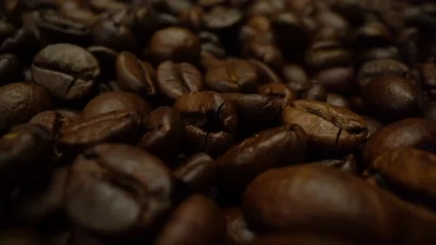 Background of roasted coffee beans in macro 4k video. Coffee beans close-up 動画素材 151091310