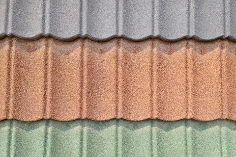 Background of roofing in the form of tiles sprayed in different colors Stock Photos