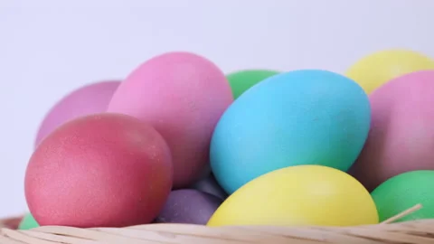 Background of rotating Easter colorful chicken eggs in basket Video stock 172566666
