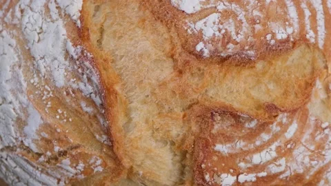Background of rotating ruddy fresh white bread, top view close-up Stock Footage 197325448