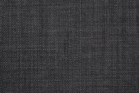 The background is a rough, dense linen fabric with a distinct braid weaving i Stock Photos