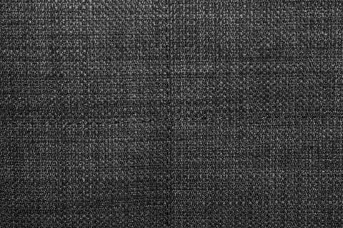 The background is a rough, dense linen fabric with a distinct braid weaving i Stock Photos
