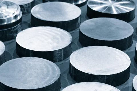 Background from round metal billets cutted in workshop, industrial background Foto stock