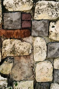 Background of rustic stones of different sizes. Stock Photos
