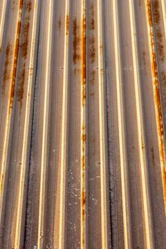 Background of rusty metal material mounted on a ceiling of a factory in panel Foto stock