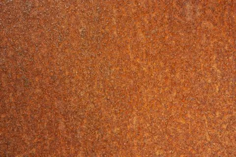 The background is a rusty orange metal surface for an inscription or banner Foto stock