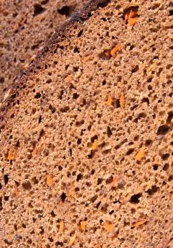 Background from rye bread with carrot Stock Photos