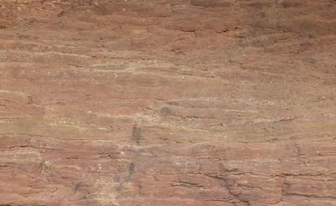 Background of a sandstone in multiple pale orange layers Stockfoto's