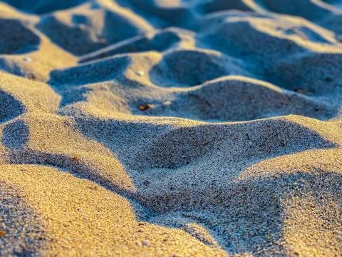 Background of a sandy surface on sunset Foto stock