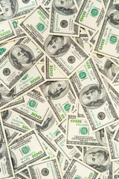 Background from scattered dollar banknotes as abstract seamless. Stock Photos