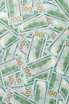 Background from scattered dollar banknotes as abstract seamless. Stock Photos