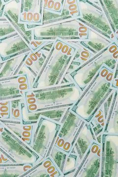 Background from scattered dollar banknotes as abstract seamless. Stock Photos