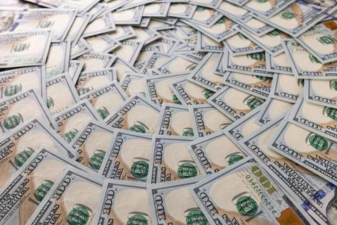 Background of Scattered One Hundred US Dollar Bills Representing Wealth and.. Stock Photos