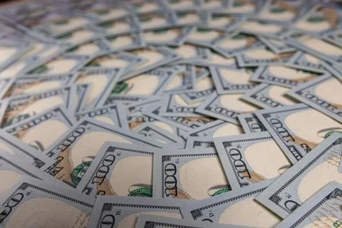 Background of Scattered One Hundred US Dollar Bills Representing Wealth and.. Stock Photos