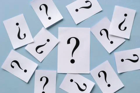 Background of scattered printed question marks Stock Photos