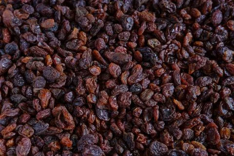 Background of scattered raisins. Stock Photos