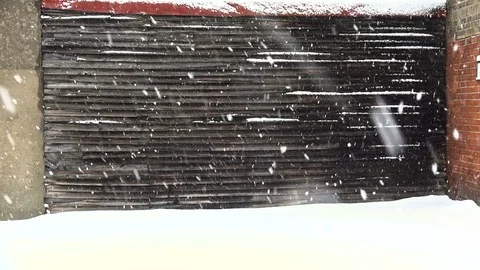 Background scenery, snowing against solid exterior background, 4k loop. Stock Footage 83424973